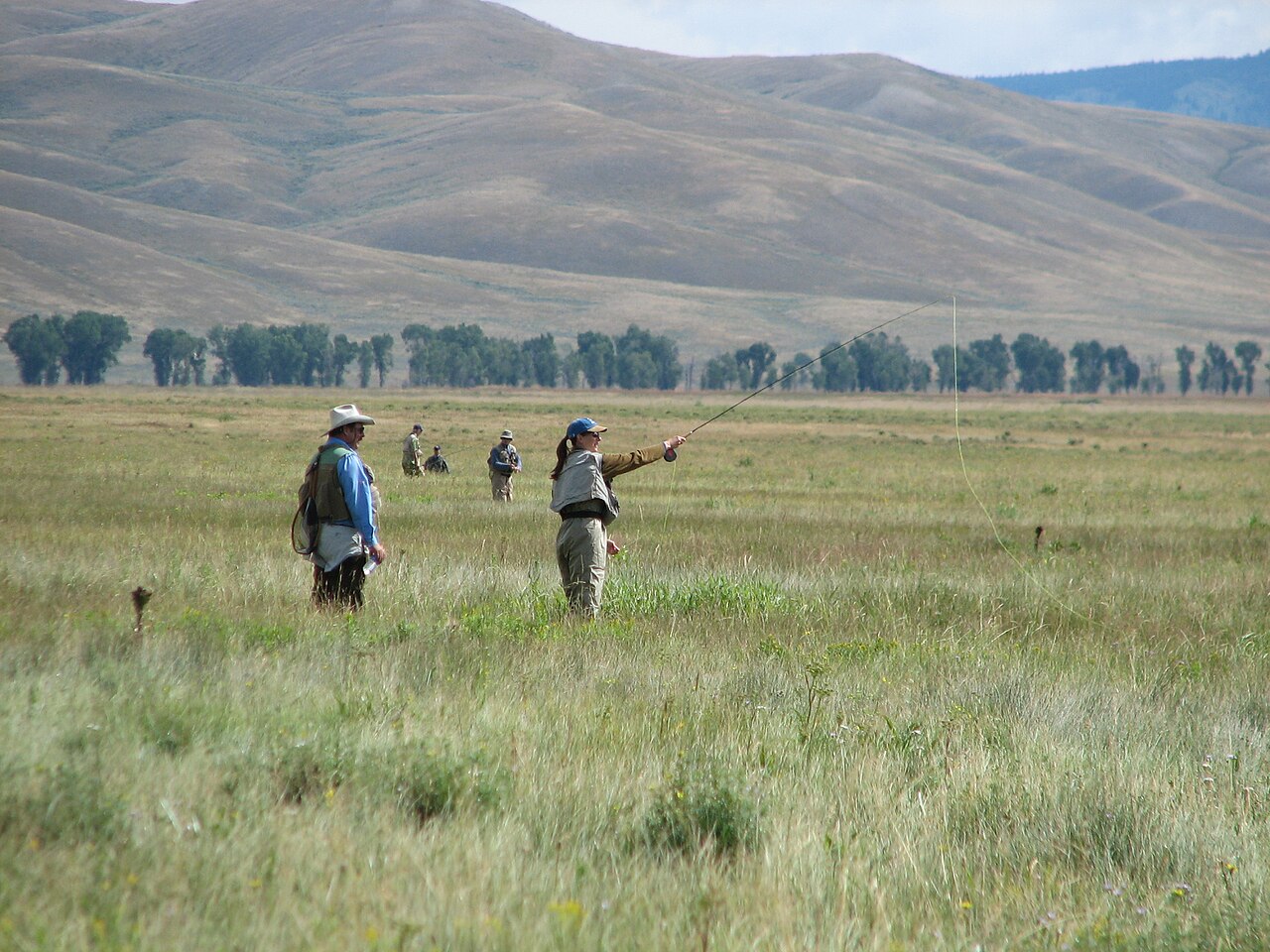 Fly fishing anglers in crystal-clear Patagonian waters